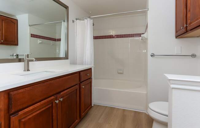 A bathroom with a white toilet and a white sink.