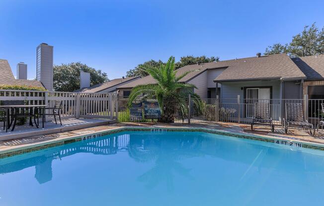 a house with a large pool of water