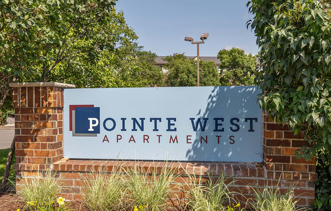 a sign at the entrance of pointe west apartments