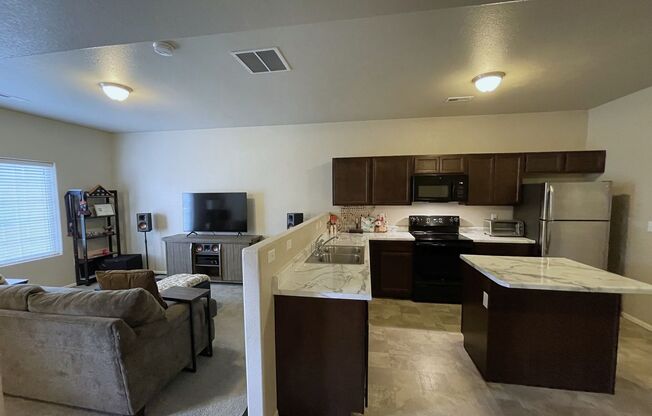 3 bed 3 bath townhome in gated community w/ pool and gym + 2 car garage!