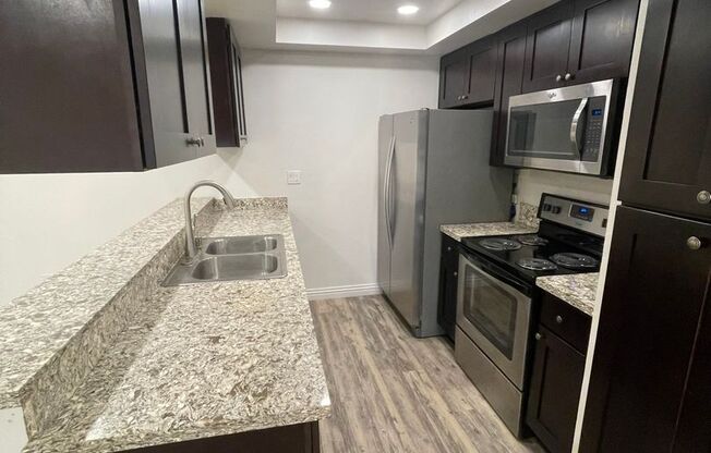 Beautiful 2 BD, 2 BA First Floor Condo at Mission Plaza! 1000 Sq Ft w/ Great Amenities!