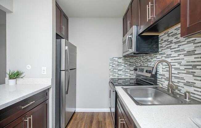 a kitchen with a stove top oven sitting inside of a building