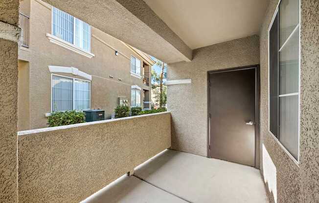 A balcony with a door at The Equestrian by Picerne, Nevada