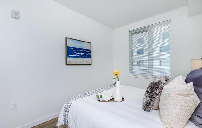 a bedroom with a bed and a large window at Jefferson Yards, Tacoma, WA