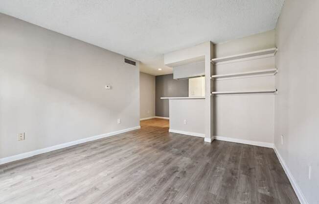 A room with a grey floor and white walls.