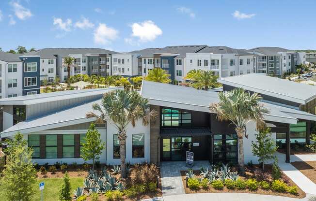 a building with palm trees in front of it