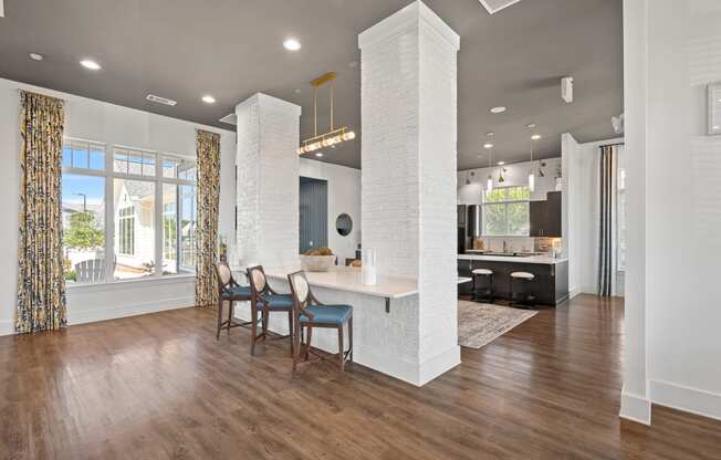 a living room with a kitchen and a dining room