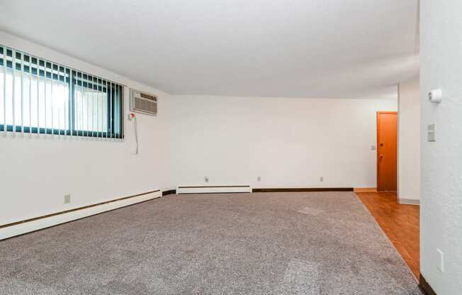 White Bear Lake, MN White Bear Terrace Apartments.  a living room with a carpeted floor and a large window