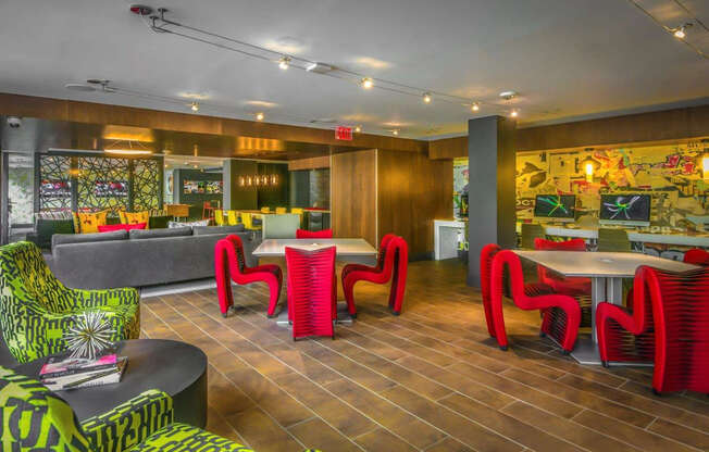 A room with a wooden floor and a mural on the wall.