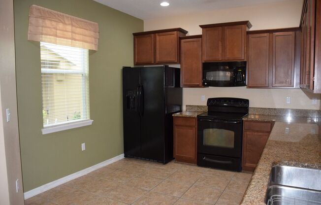Spacious 3 Bed 2.5 Bath Condo in Gated Tucker Oaks Community with No Rear Neighbors!