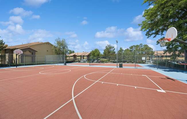 A basketball court with a net and hoop.