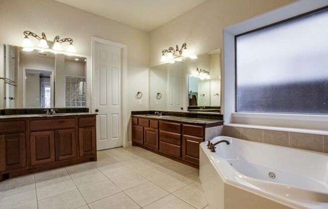 Bright and airy living room, fireplace, study, custom lighting in the formal living and dining.