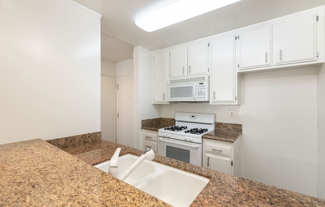 Kitchen with White Appliances and White Cabinets