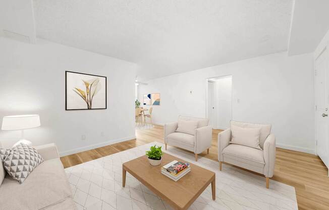 a living room with two chairs and a coffee table