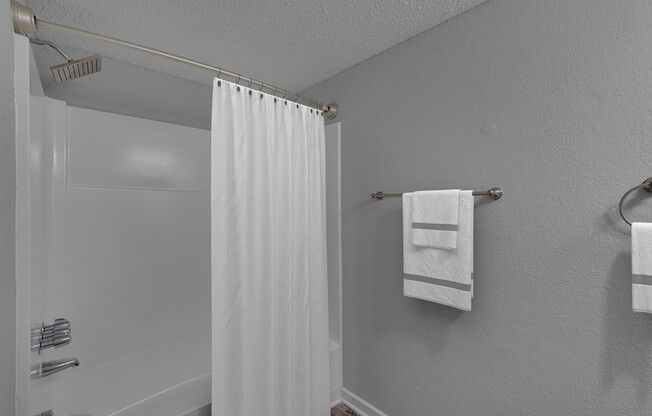 Step into modern comfort with the sleek bathroom at Icon Downtown Durham. A stylish design complements your lifestyle, featuring high-quality fixtures and a serene ambiance. Elevate your daily routine—schedule a tour today!