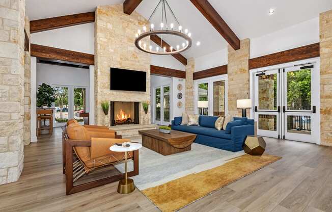 clubhouse lounge area with couches and a fireplace