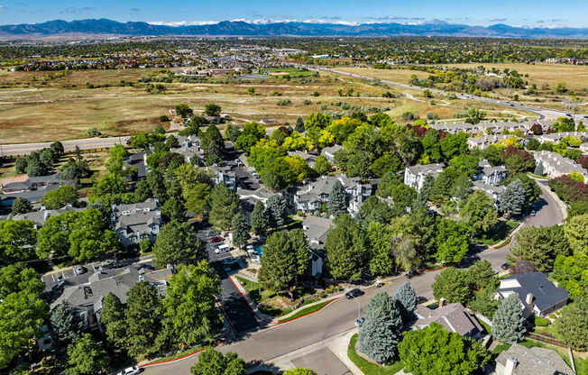 A suburban neighborhood with houses and trees.