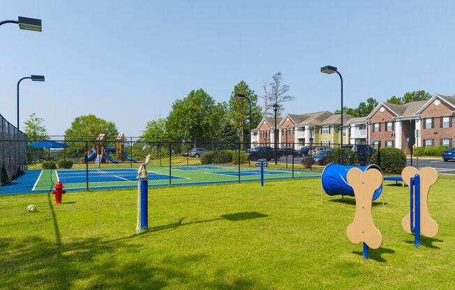 a park with a playground and a volley ball court