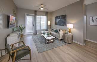 Icon at Cooley Station-apartment with open living room with a couch and a coffee table