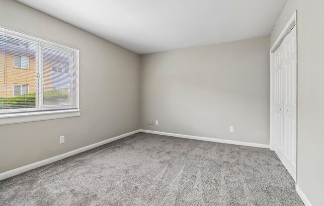 Invite comfort into your life at The Preserve On Conley Apartments. This spacious living area offers a serene vibe with plush carpeting and plenty of natural light. Embrace your new lifestyle—schedule a tour today!