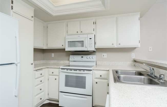 renovated kitchen with white cabinets