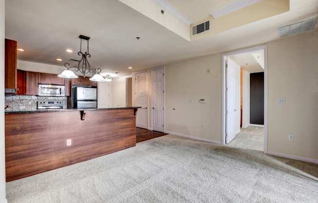 A large open room with a kitchen area in the background.