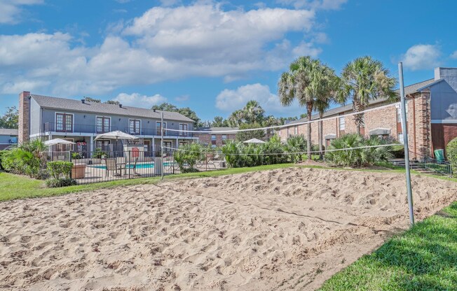 Sand volleyball court beside the pool at Magnolia apartments in Shreveport, LA