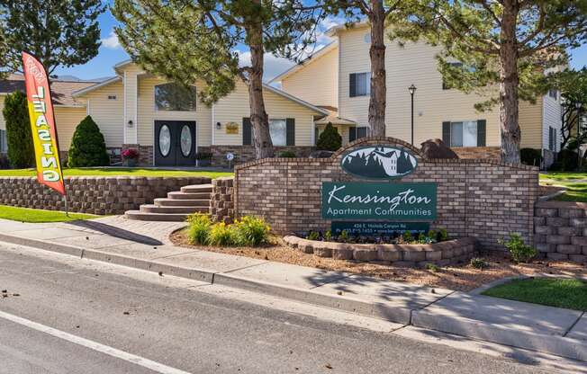 the sign in front of the apartment communities building