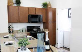 A view of the Kitchen in the 1200 Acqua model apartment home