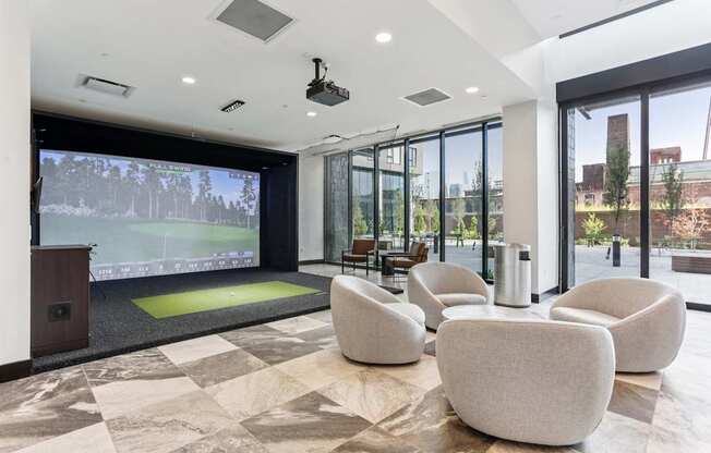 A conference room with a green screen and a view of the outside.