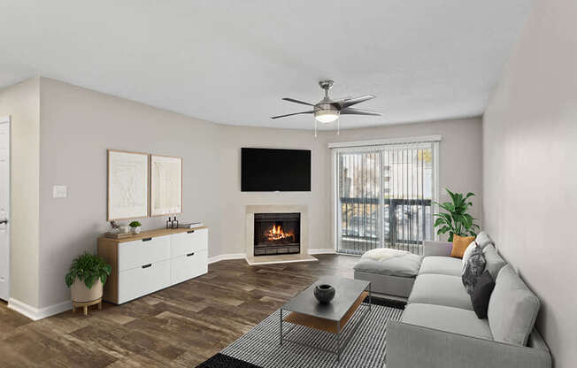 Model Living Room with Wood-Style Flooring, Fireplace and Patio Accessibility at Element 41 Apartments located in Marietta, GA.