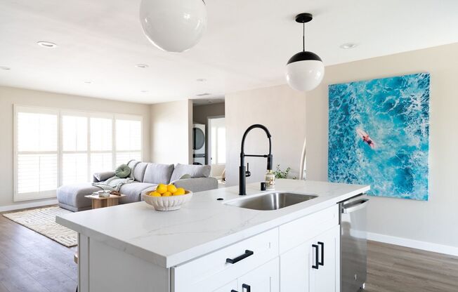 Stunning 4 Bed / 2 Bath with Chef’s Kitchen, In-Unit Laundry and Shared Backyard Retreat