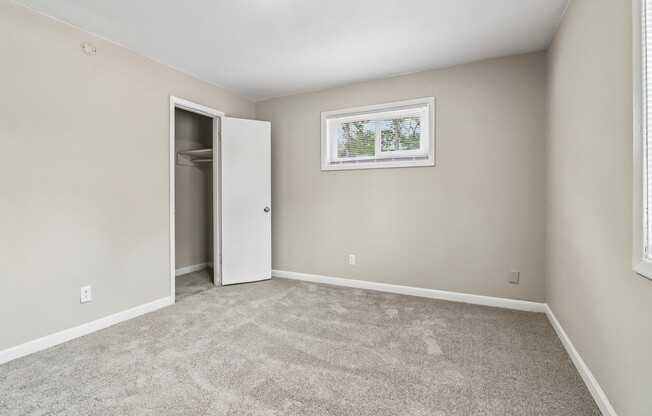 Step into the inviting interiors of The Preserve On Conley Apartments. This spacious bedroom features plush carpeting and abundant natural light, setting the perfect backdrop for your personal retreat. Explore your new home today!