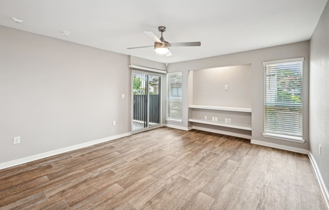 Bright and inviting living room area in the D5 floor plan at Windridge On The Parkway Apartments in Dallas, TX