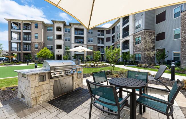 Outdoor grill and picnic area at Cyan Craig Ranch apartments for rent in McKinney, TX