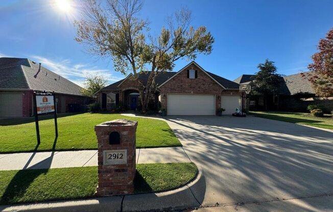 Executive Living in Moore Schools! 3 bedrooms plus office or 4th bed, covered patio and Storm shelter!