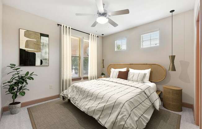 a bedroom with a large bed and a ceiling fan