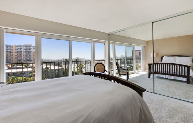 Bedroom with mirrored closet doors, balcony with great views, carpet floorings