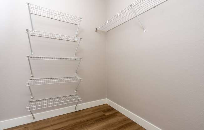 our spacious closets are equipped with a spacious walk in closet with metal shelves