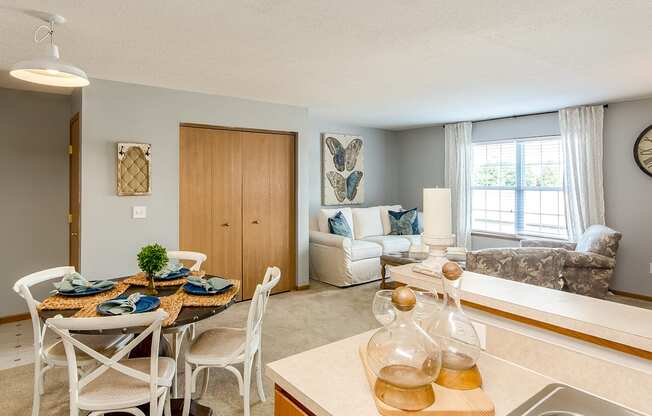 A kitchen with a dining table set for four.