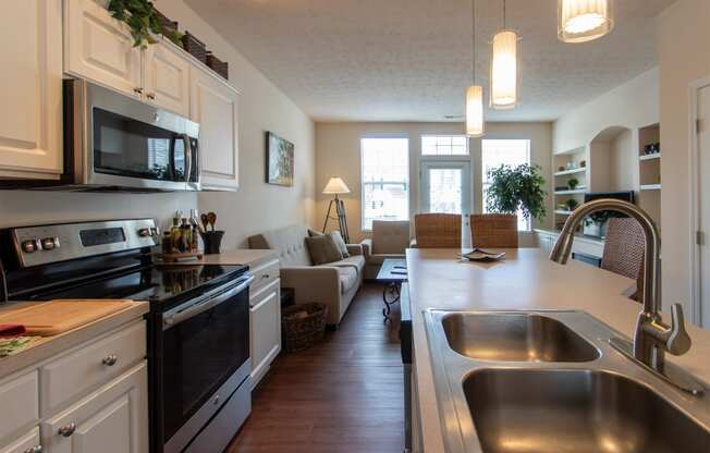 This is a photo of the kitchen in the 1242 square foot, 2 bedroom, 2 and 1/2 bath Spinnaker floor plan at Nantucket Apartments in Loveland, OH.