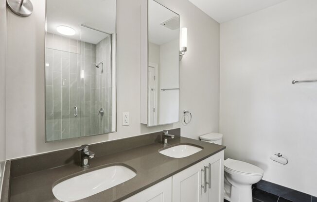 Bathroom with a toilet and sink at Park77 Apartments, Cambridge, MA