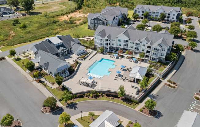 an aerial view of a large house with a swimming pool