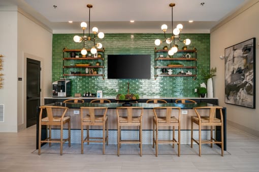 a dining room with a long table and chairs and a television