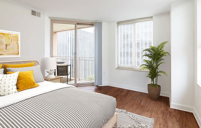 Bedroom with balcony hard surface flooring