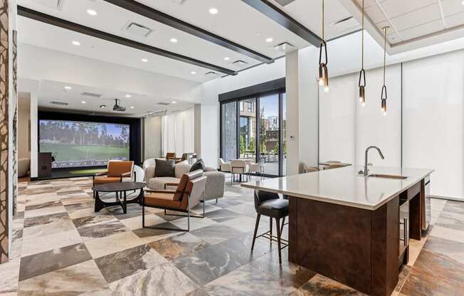 A modern kitchen and living room with a marble floor and a large window.