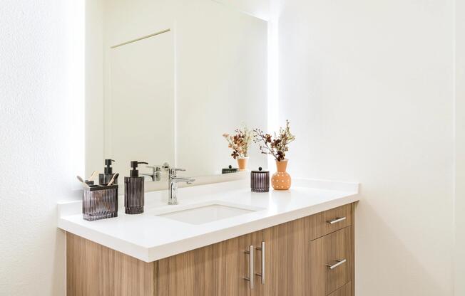 Modern bathrooms feature sleek cabinetry, expansive counter space, and multiple finish options that provide a refined, contemporary aesthetic.