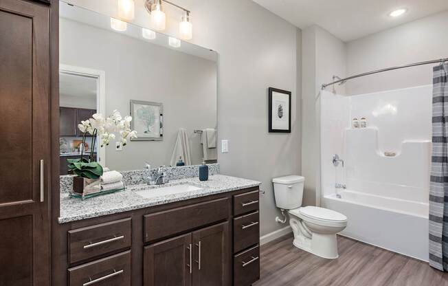 A bathroom with a white toilet and a white sink.