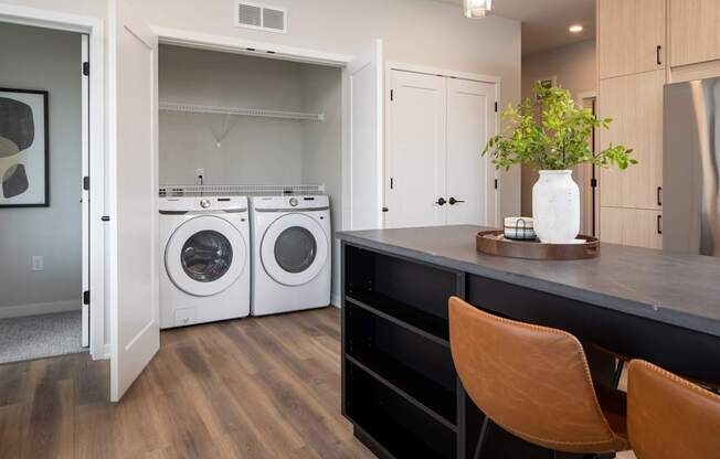 A laundry room with a washer and dryer in it.