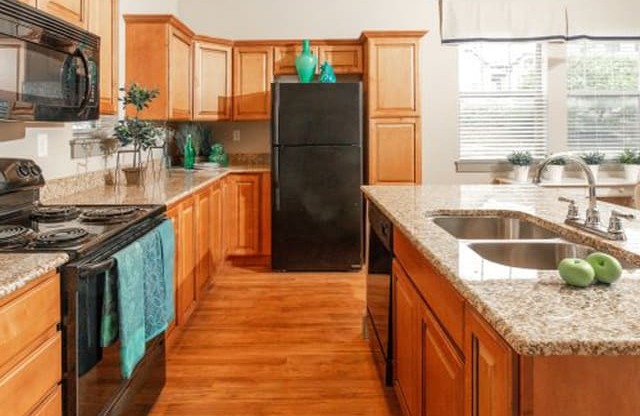 Fully Furnished Kitchen With Stainless Steel Appliances at San Moritz Apartments, Midvale, Utah